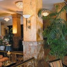 Luxor™ Classical Sconce with Navarra Alabaster Bowl Illuminates Historic Hotel Lobby