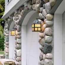 Exterior Garage Lighting on Unique Field Stone Wall