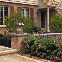 French Country™ Lanterns Light a Front Walkway of Traditional Style Home