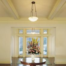 Hampton™ Family Alabaster Pendant Illuminates a Grand Hotel Lobby