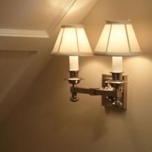 A Morris™ Two Light Straight Arm Sconce Lights Stairway to Finished Basement