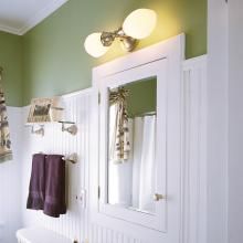 Cottage Style Bathroom Lit with a Retro Sconce