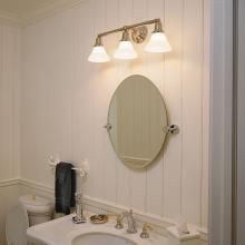 Bathroom Vanity Lit with Shoreland™ Three Light Straight Arm Sconce